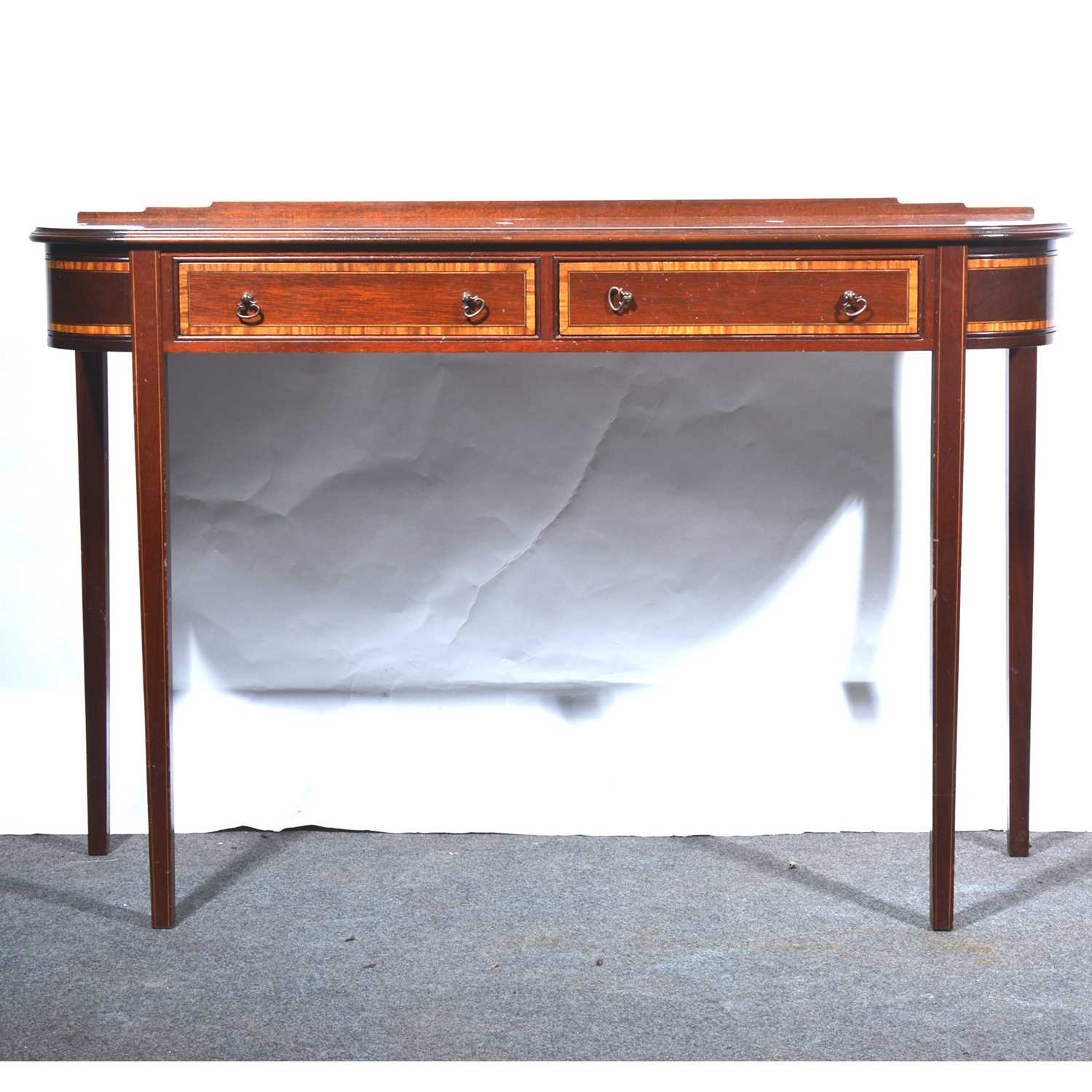 Lot 443 - A reproduction mahogany console table, in the Sheraton style
