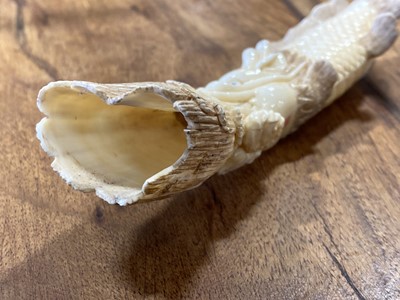 Lot 54 - A Japanese carved ivory okimono, early 20th Century