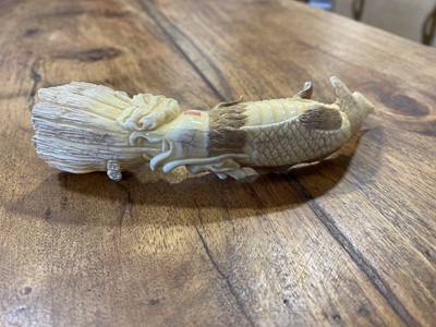 Lot 54 - A Japanese carved ivory okimono, early 20th Century