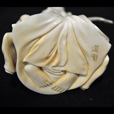 Lot 64 - A Japanese carved ivory okimono, Meiji