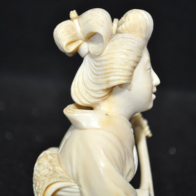 Lot 64 - A Japanese carved ivory okimono, Meiji