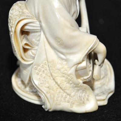 Lot 64 - A Japanese carved ivory okimono, Meiji