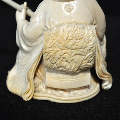 Lot 64 - A Japanese carved ivory okimono, Meiji