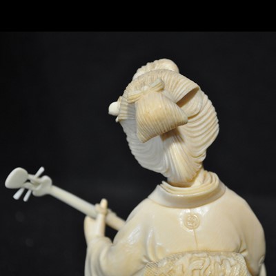 Lot 64 - A Japanese carved ivory okimono, Meiji