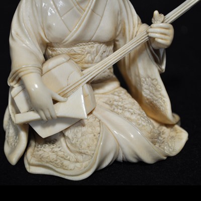 Lot 64 - A Japanese carved ivory okimono, Meiji