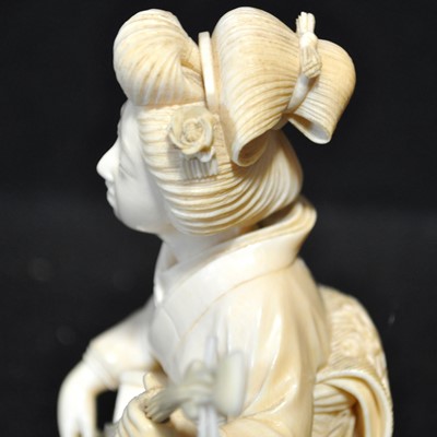 Lot 64 - A Japanese carved ivory okimono, Meiji