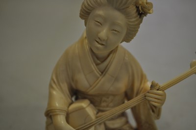 Lot 64 - A Japanese carved ivory okimono, Meiji