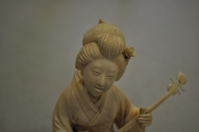 Lot 64 - A Japanese carved ivory okimono, Meiji
