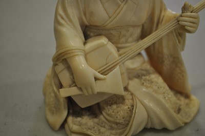 Lot 64 - A Japanese carved ivory okimono, Meiji
