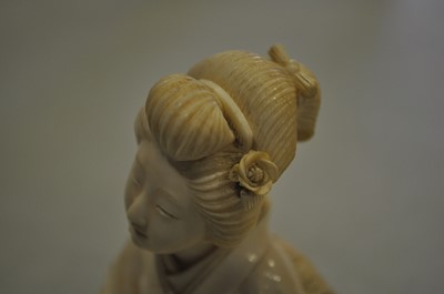 Lot 64 - A Japanese carved ivory okimono, Meiji