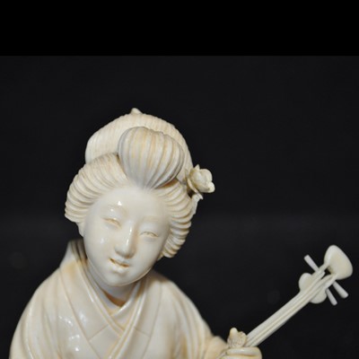 Lot 64 - A Japanese carved ivory okimono, Meiji