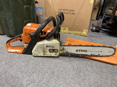 Lot 677 - Stihl MS290 chainsaw; Stihl 25 chainsaw; safety helmet; and boots.