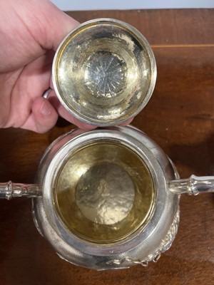 Lot 45 - Chinese silver three piece teaset with sugar tongs and a rosewood tray