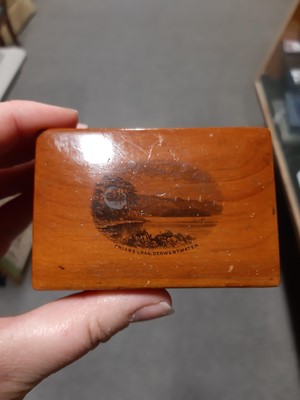 Lot 17 - Mauchline ware boxes, napkin rings, marquetry pin cushions, and other wooden items.