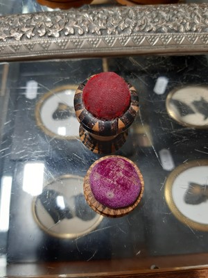 Lot 17 - Mauchline ware boxes, napkin rings, marquetry pin cushions, and other wooden items.
