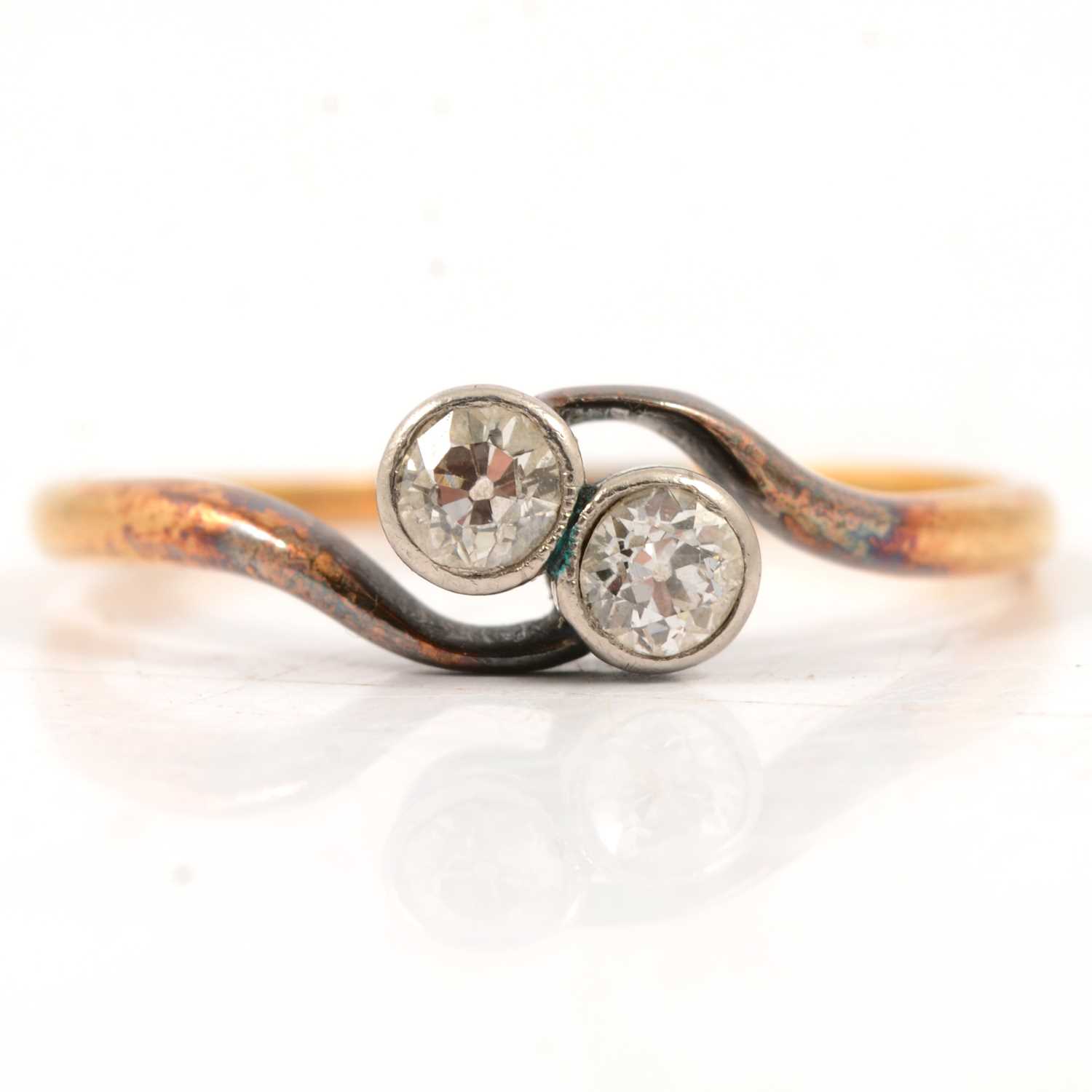 Lot 11 - A diamond two stone crossover ring