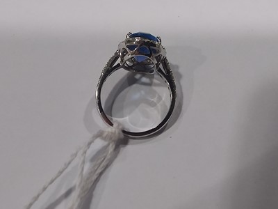 Lot 44 - A tanzanite and diamond cluster ring.