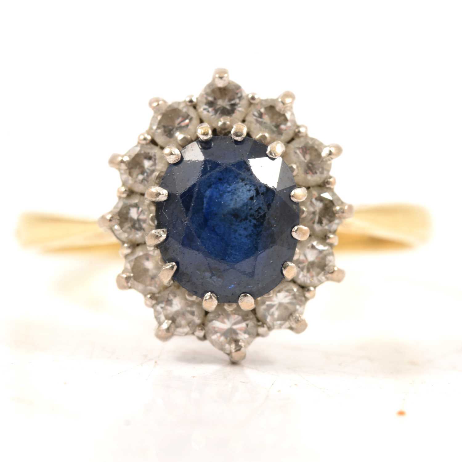 Lot 46 - A sapphire and diamond cluster ring