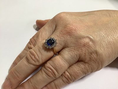 Lot 46 - A sapphire and diamond cluster ring
