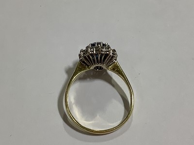 Lot 46 - A sapphire and diamond cluster ring