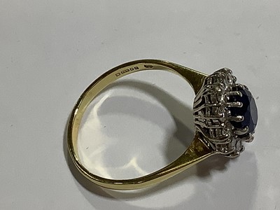 Lot 46 - A sapphire and diamond cluster ring