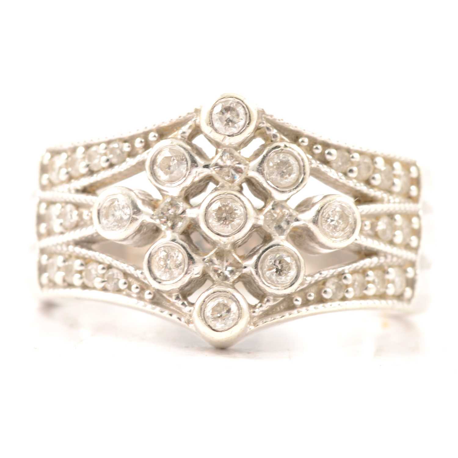 Lot 23 - A diamond multi stone half hoop ring.