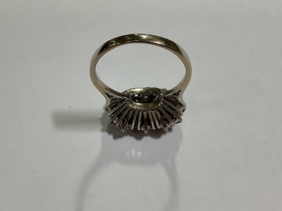 Lot 50 - A sapphire and diamond triple cluster ring.