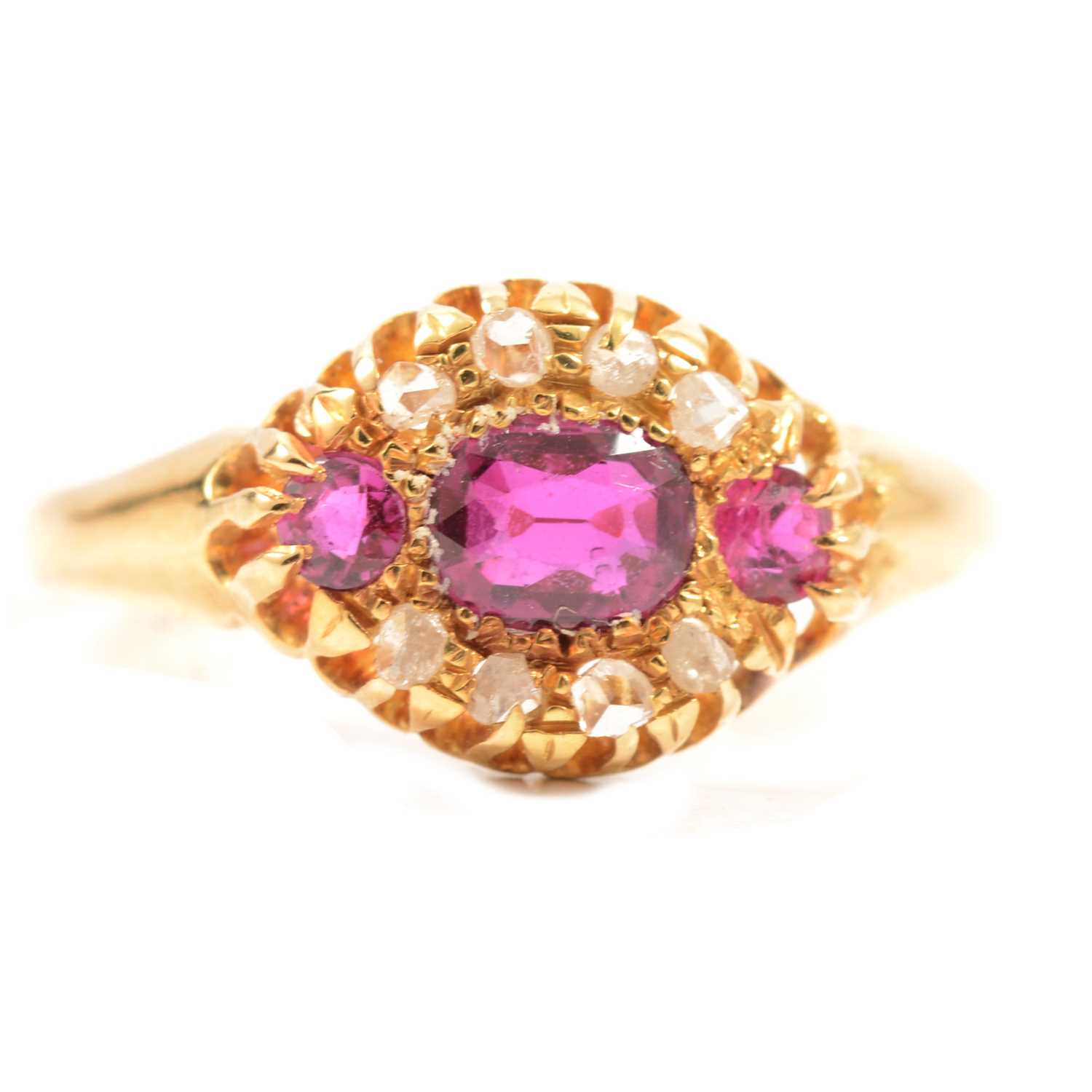 Lot 72 - A diamond and untested pink stone cluster ring.