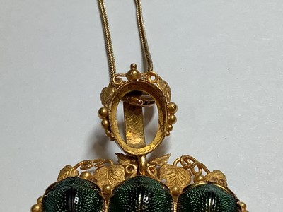 Lot 229 - A yellow metal scarab style pendant on a foxtail link chain.