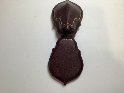 Lot 229 - A yellow metal scarab style pendant on a foxtail link chain.