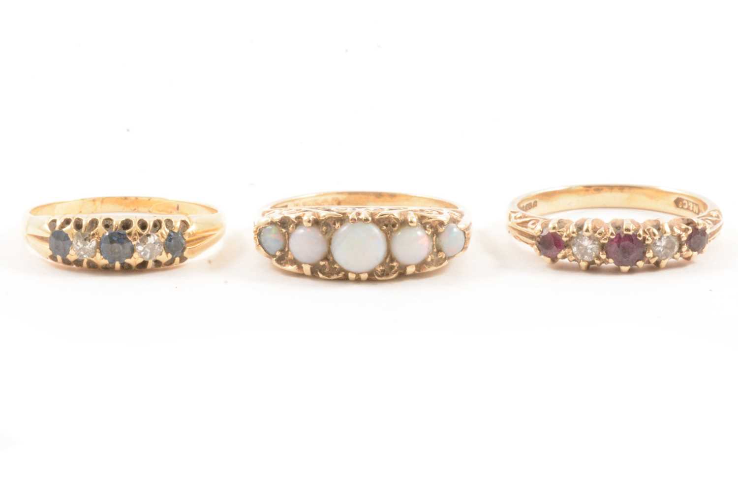 Lot 114 - Three gemset rings.