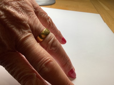 Lot 105 - A 22 carat yellow gold wedding band.