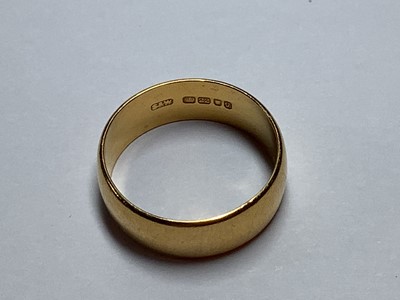 Lot 105 - A 22 carat yellow gold wedding band.