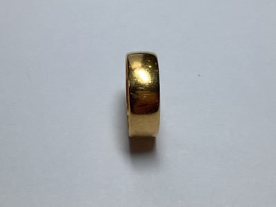 Lot 105 - A 22 carat yellow gold wedding band.