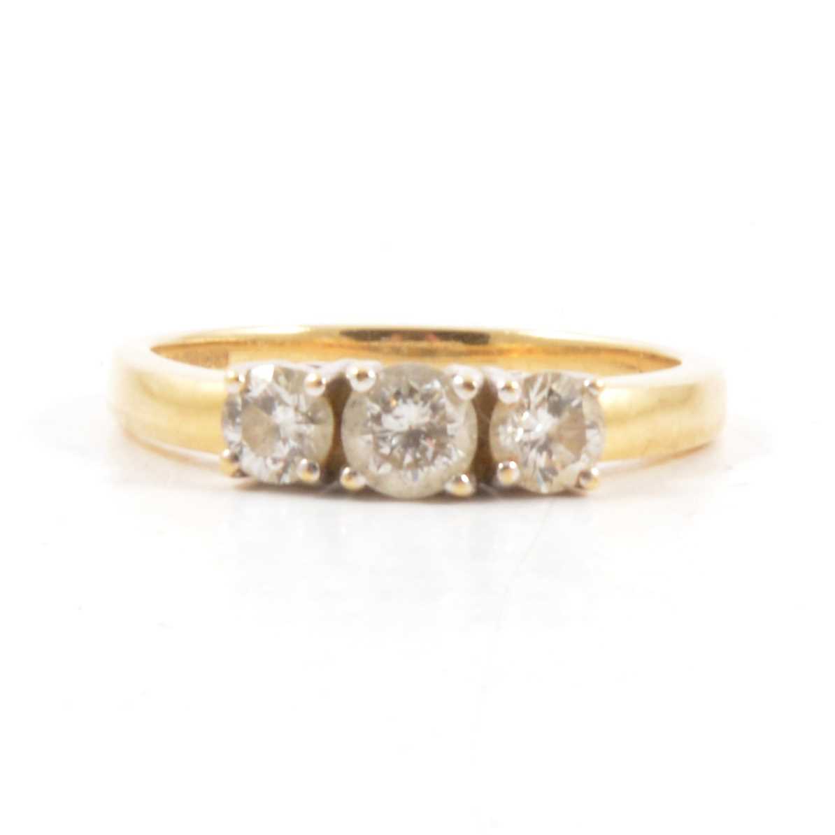 Lot 6 - A diamond three stone ring.