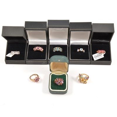 Lot 124 - Eighteen modern gemset 9 carat gold rings.