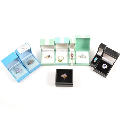 Lot 125 - Thirty modern gemset white metal rings.