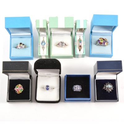 Lot 126 - Thirty-one modern gemset white metal and gilded white metal rings.