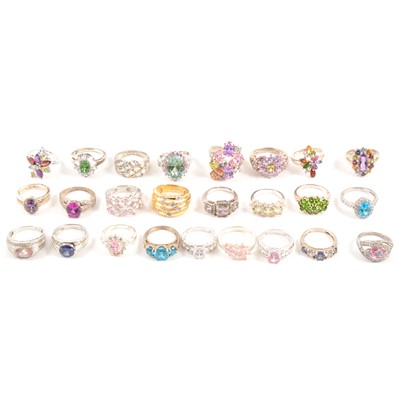 Lot 127 - Thirty-one modern gemset white metal and gilded white metal rings.