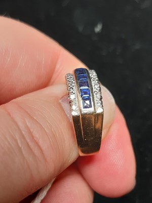 Lot 19 - A sapphire and diamond half hoop ring.