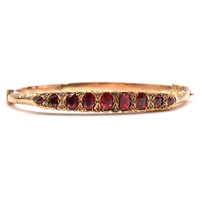Lot 243 - An Edwardian half hinged bangle.
