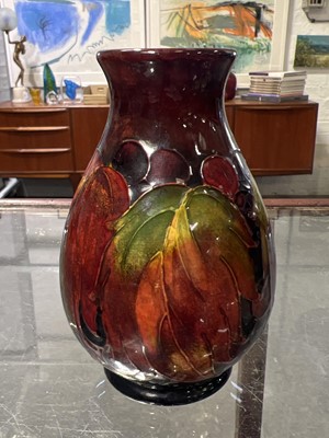 Lot 523 - Moorcroft Pottery, a flambe 'Leaf and Berry' design vase