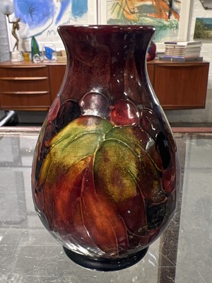Lot 523 - Moorcroft Pottery, a flambe 'Leaf and Berry' design vase