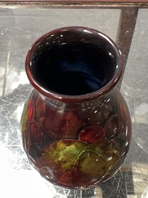 Lot 523 - Moorcroft Pottery, a flambe 'Leaf and Berry' design vase