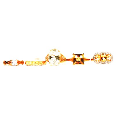Lot 21 - Seven white, yellow and brown gemset rings, cubic zirconia, smoky quartz, citrine.