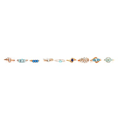 Lot 24 - Nine aquamarine, blue zircon, blue topaz and other blue gemstone and diamond rings.