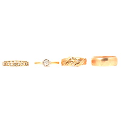 Lot 113 - A diamond solitaire and three other gold rings.