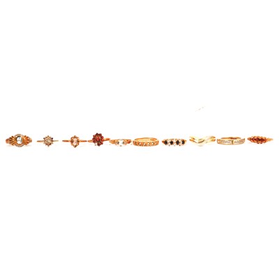 Lot 26 - Ten 9 carat yellow gold and yellow metal rings, some gemset.