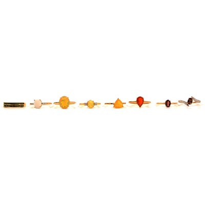 Lot 52 - Eight gemset gold rings, Ethiopian opal, fire opal, colour change garnet.
