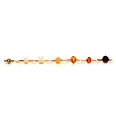 Lot 57 - Seven gemset gold rings, ultraviolet colour change garnet, Coober Pedy opal and others.
